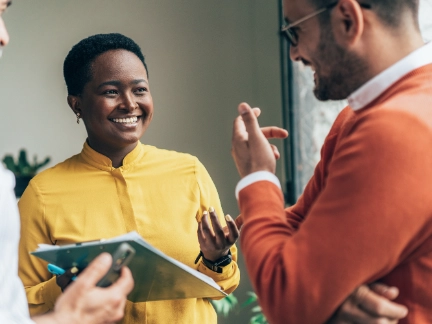 Woman and two men talking